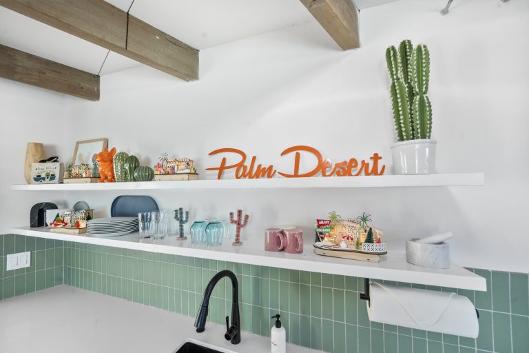 Coffee bar with Palm Desert sign and cactus decor