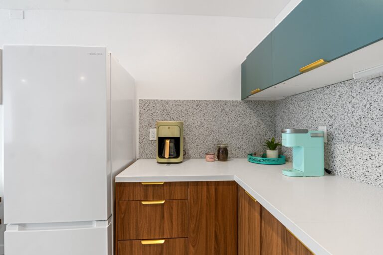 Blue condo coffee station by the fridge
