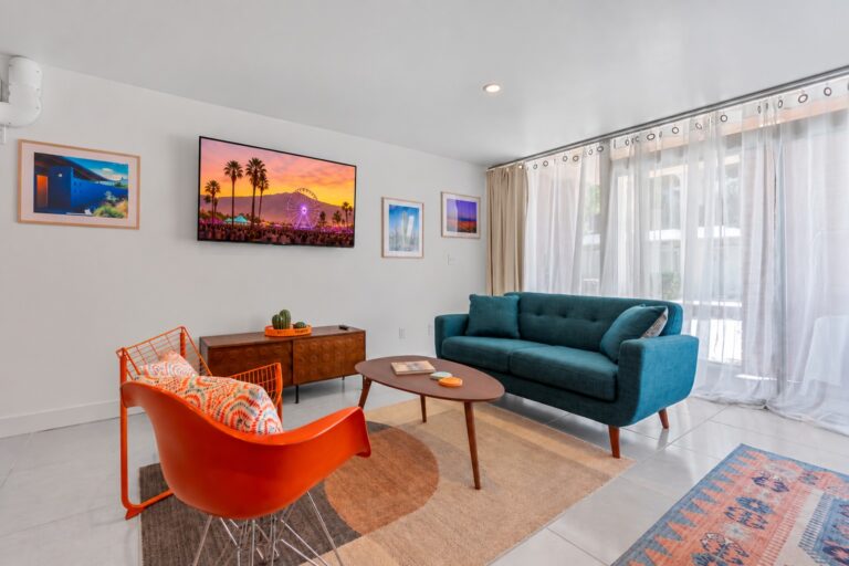 Blue condo living room with teal sofa