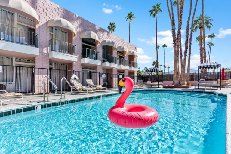 Community pool with palm trees