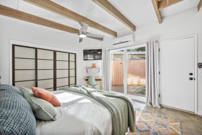 House bedroom with doors to the patio