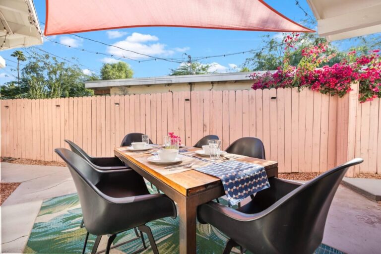House outdoor dining under the shade sail