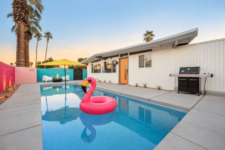 Pink flamingo float in the saltwater pool at the Palm Desert mid-century house