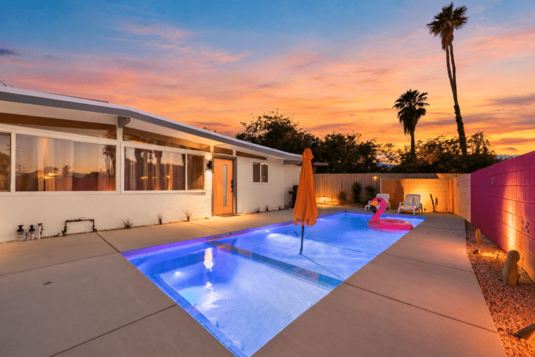 Pool glowing at sunset at the Palm Desert mid-century house
