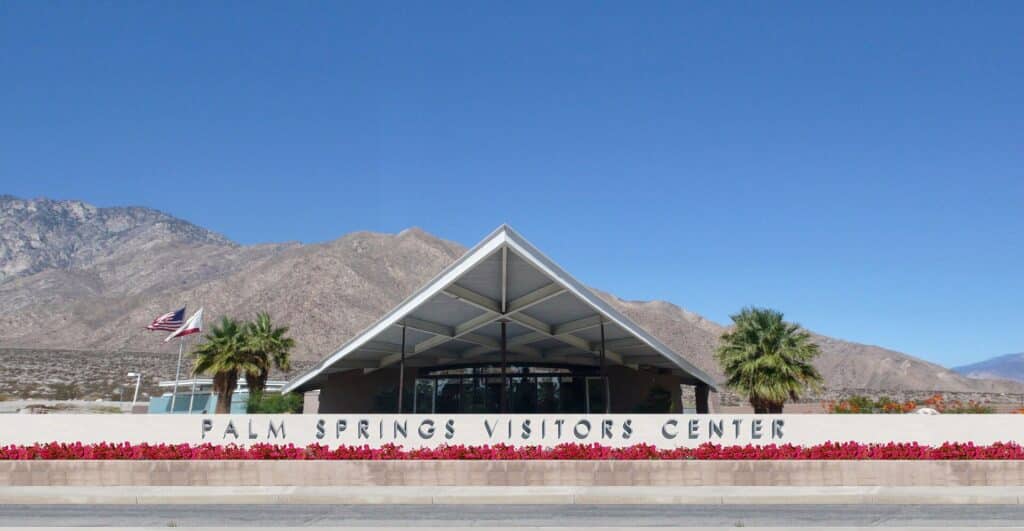 Albert Frey designed Palm Springs Visitors Center with its swooping roof and the San Jacinto Mountains behind