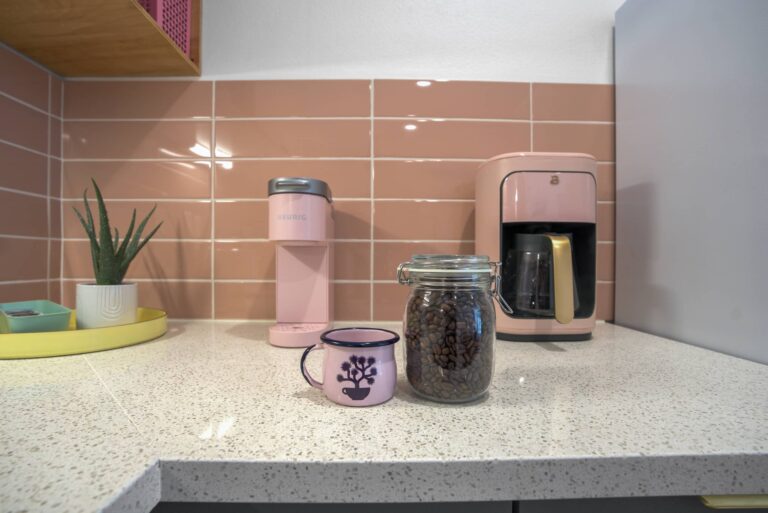 Pink condo kitchen counter with coffee maker