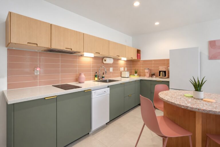 Pink condo sage green kitchen with blush tile