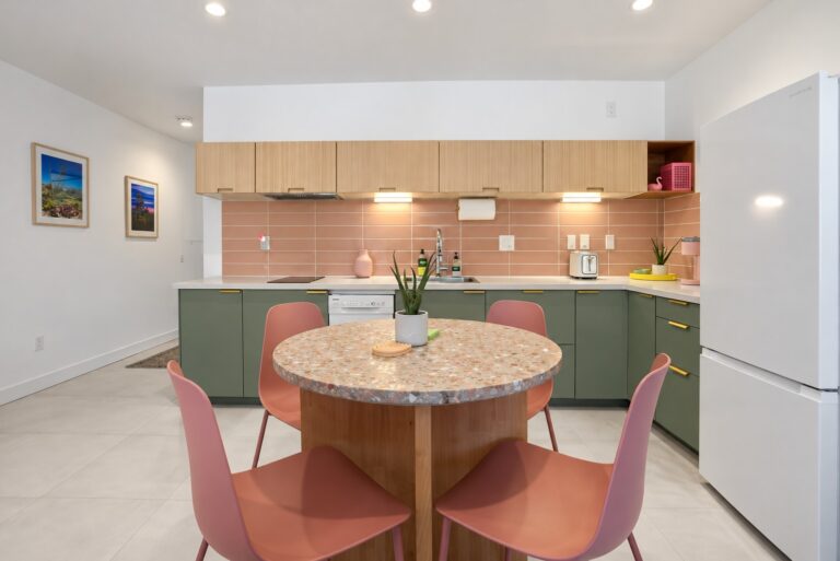 Pink condo kitchen and terrazzo dining table