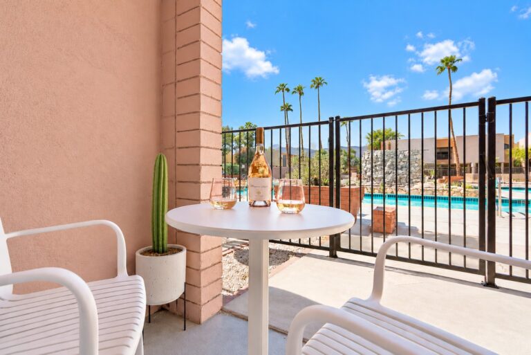 Pink condo patio with pool view