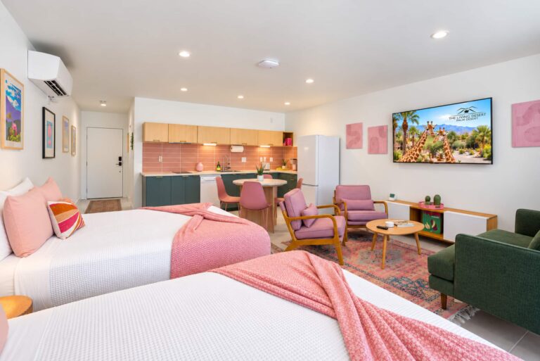 Pink condo two queen beds and living area