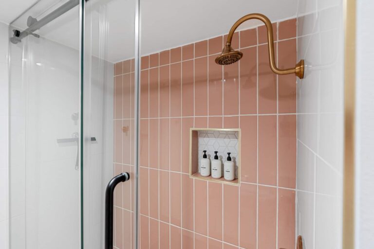 Pink condo tiled shower