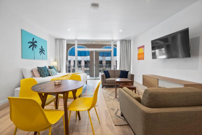 Yellow condo dining table and balcony doors
